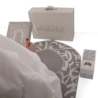 Grey set contains prayer carpet, matching prayer dress, Quran, incense burner, bakhor storage box with gift box