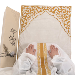 set of beige prayer carpet with matching prayer dress 