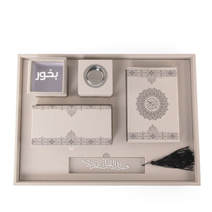 A beige set contains Quraan, incense burner, box, bakhor box, and bookmark 
