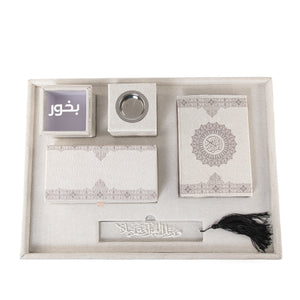 A grey set contains Quraan, incense burner, box, bakhor box, and bookmark