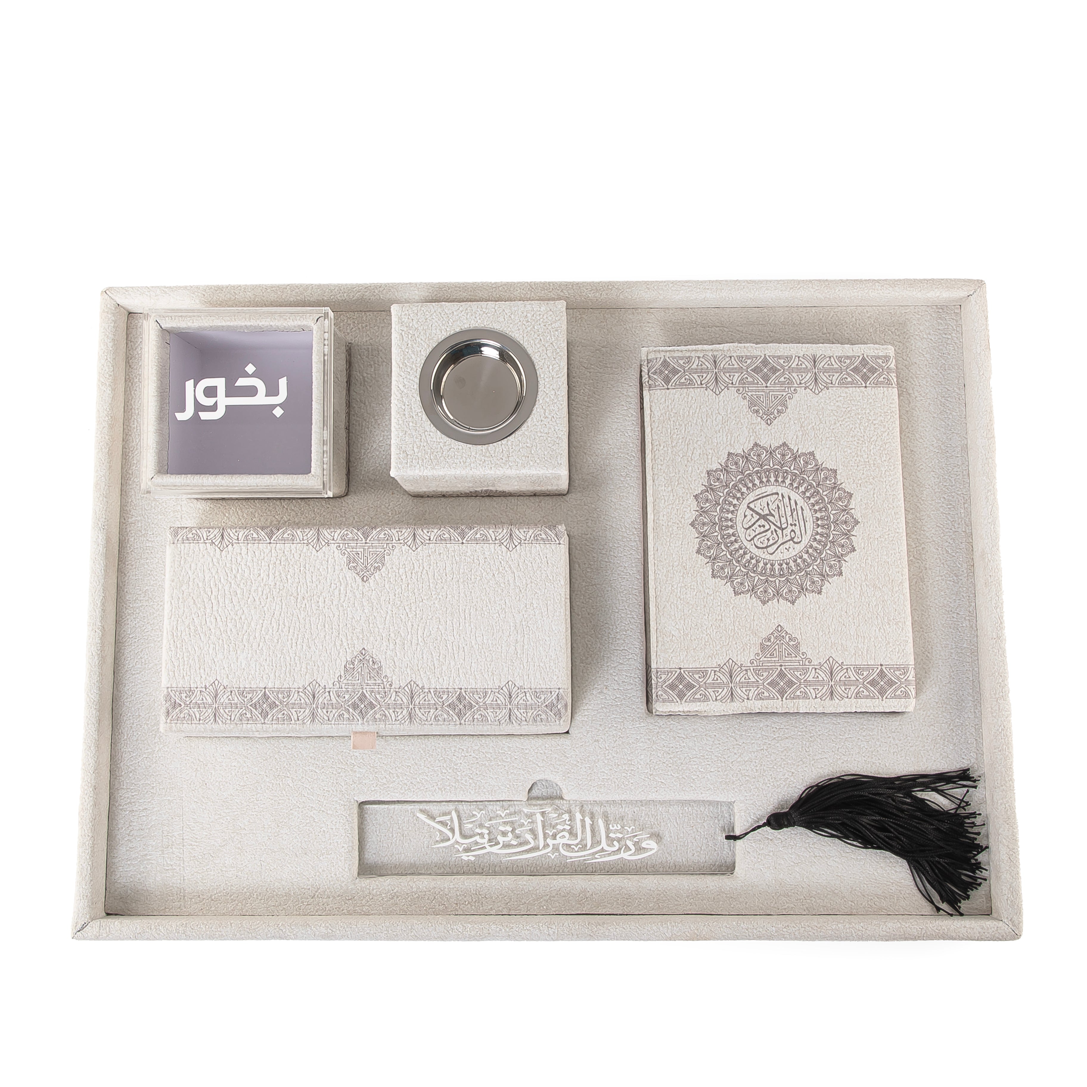 A grey set contains Quraan, incense burner, box, bakhor box, and bookmark