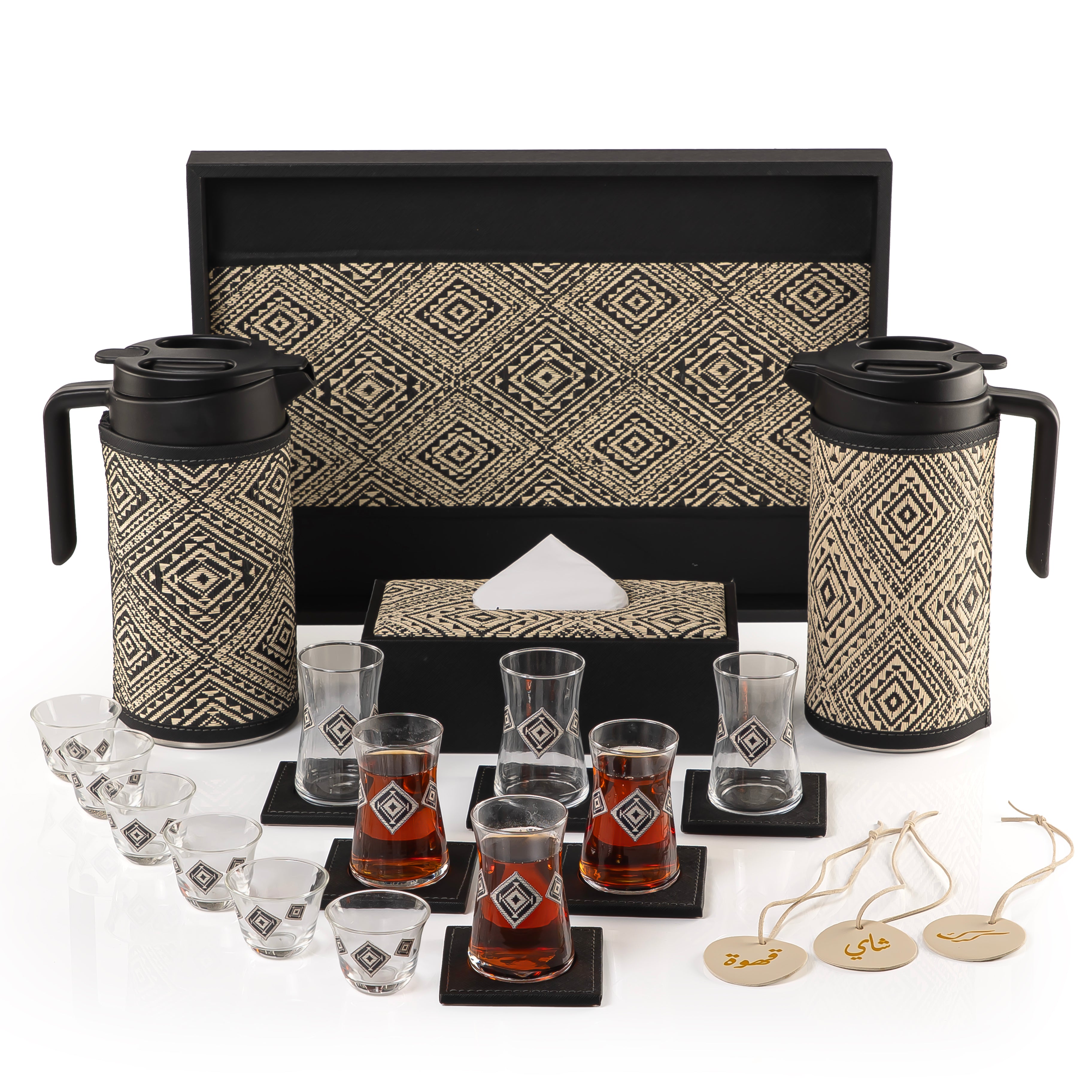 A black tray holding two thermoses with fabric covers, six coffee glasses, six tea glasses, six coasters, three labels "Tea, Karak, Coffee", and tissue box