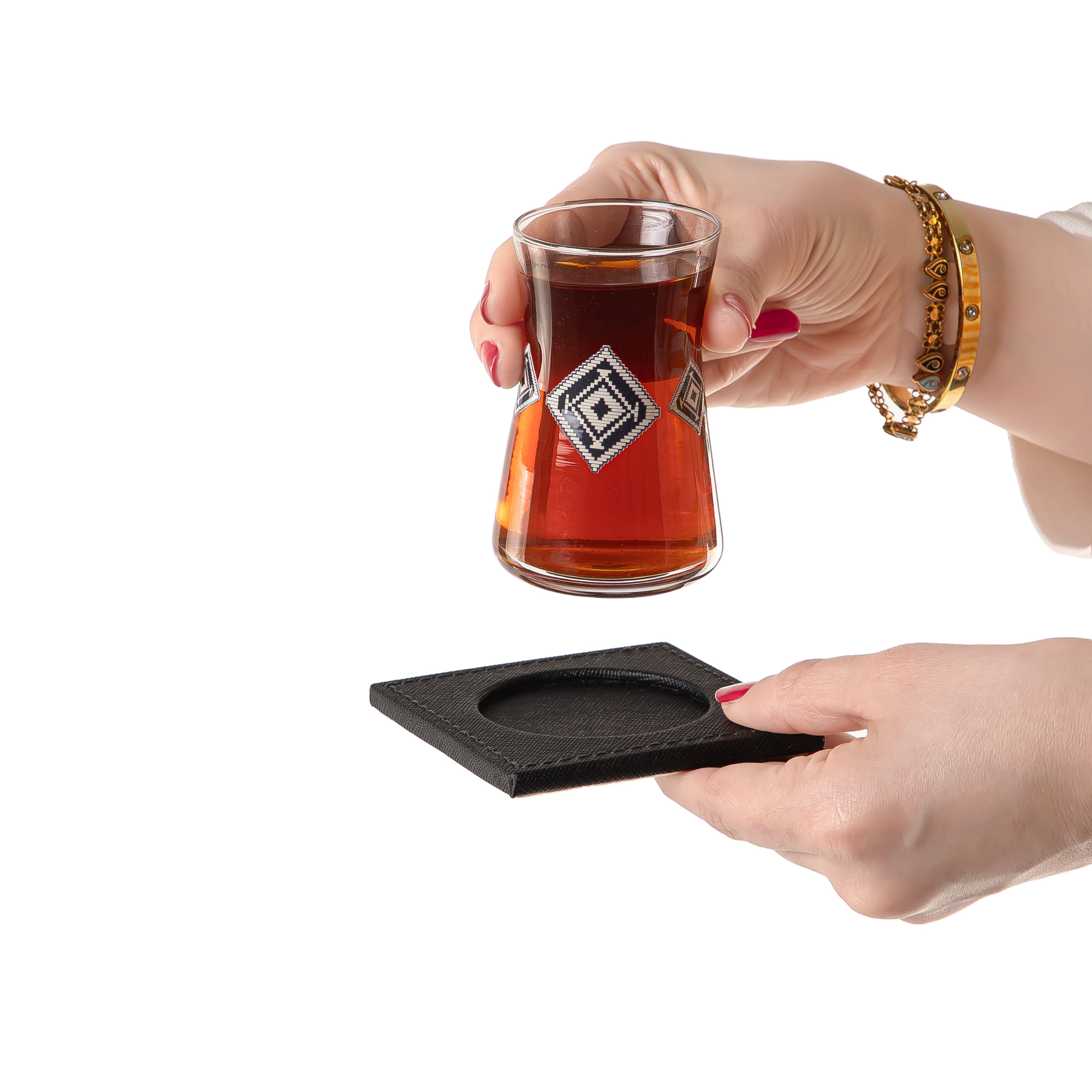 tea glass with black coaster