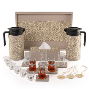 A grey tray holding two thermoses with fabric covers, six coffee glasses, six tea glasses, six coasters, three labels "Tea, Karak, Coffee", and tissue box