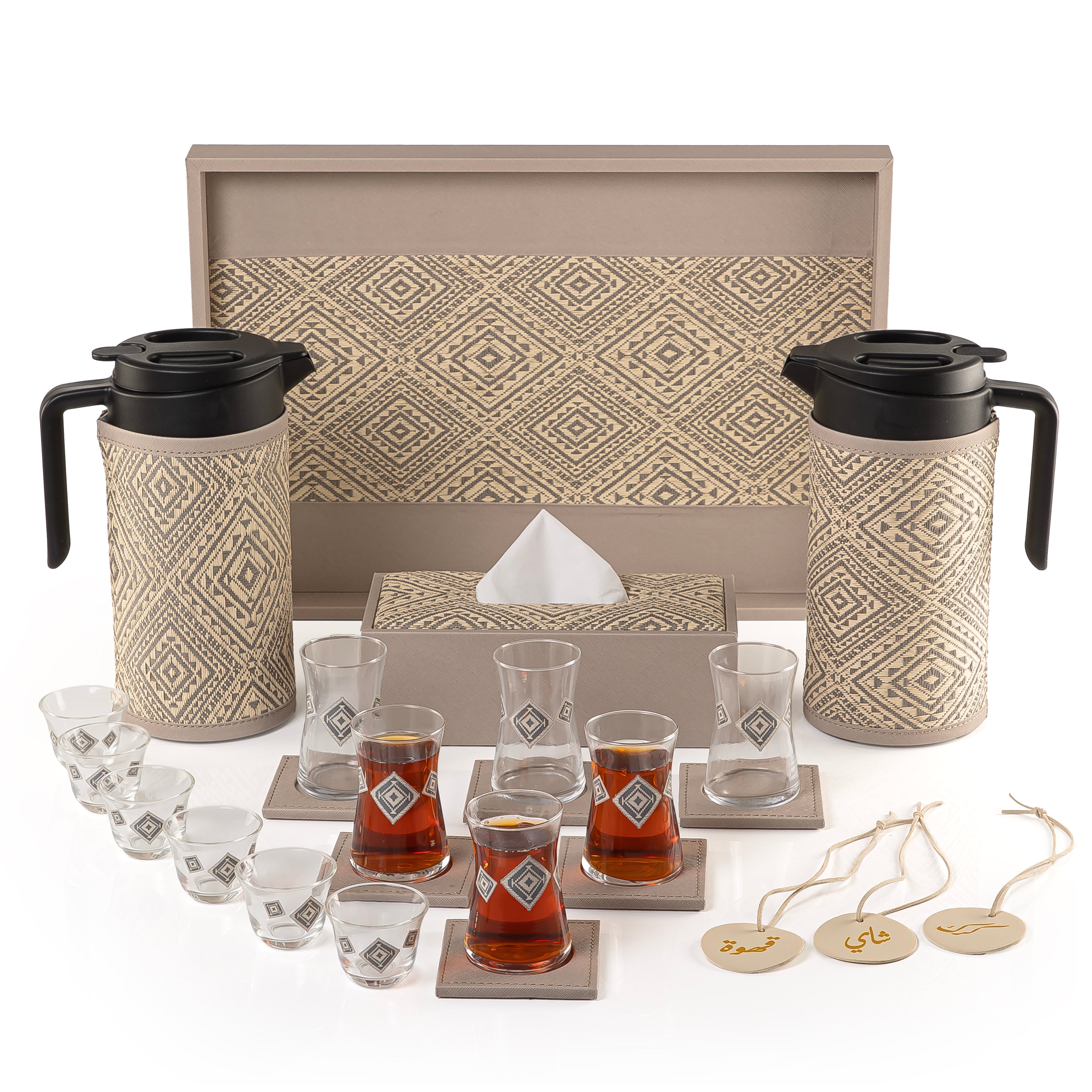 A grey tray holding two thermoses with fabric covers, six coffee glasses, six tea glasses, six coasters, three labels "Tea, Karak, Coffee", and tissue box
