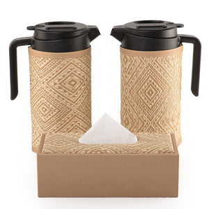 two thermoses with beige fabric covers and tissue box