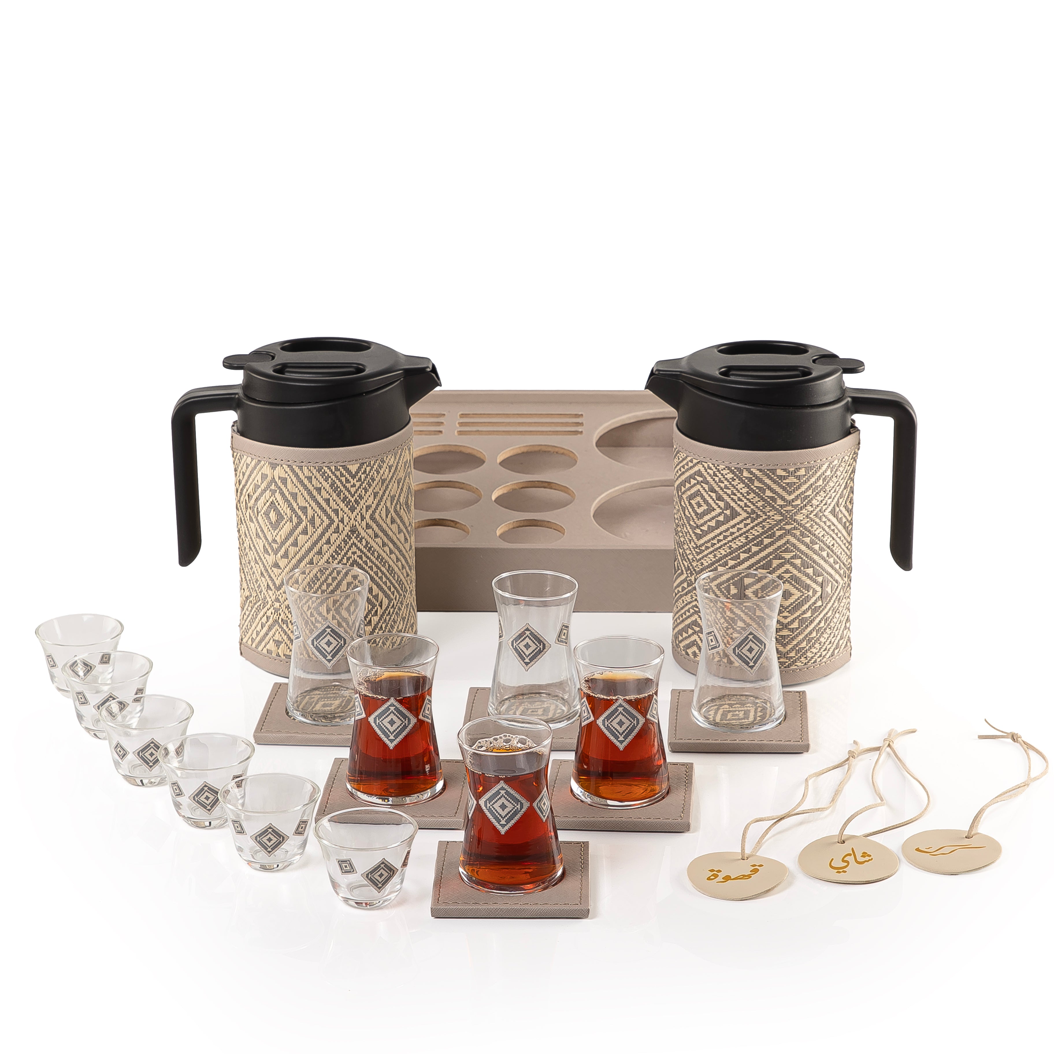 A grey tray holding two thermoses with  fabric covers, six coffee glasses, six tea glasses, six coasters, three labels "Tea, Karak, Coffee"