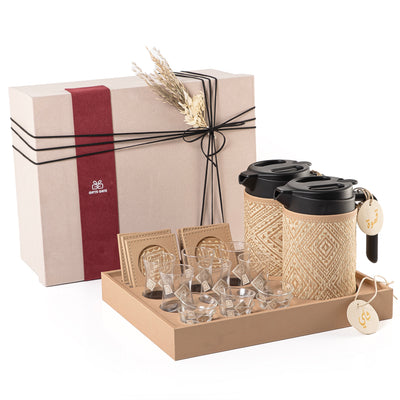A beige tray holding two thermoses with  fabric covers, six coffee glasses, six tea glasses, six coasters, three labels "Tea, Karak, Coffee" with a gift box