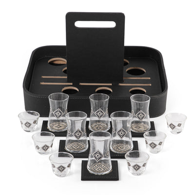A black stand with a handle, holding six coffee glasses, six tea glasses, and six coasters