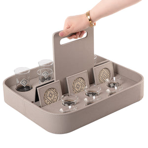 A grey stand with a handle, holding six coffee glasses, six tea glasses, and six coasters