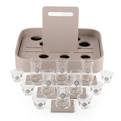 A grey stand with a handle, holding six coffee glasses, six tea glasses, and six coasters