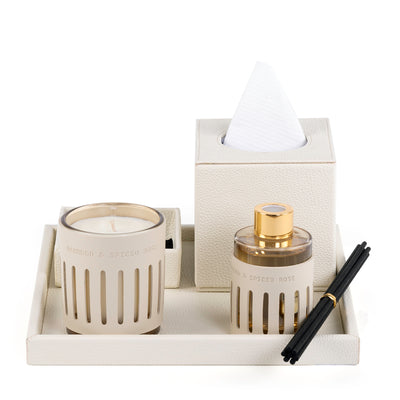 Off-white leather tray with matching tissue box, plate, candle, and diffuser