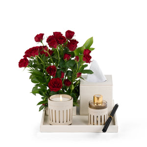 Beige Leather tray with matching tissue box, red roses, candle, and diffuser