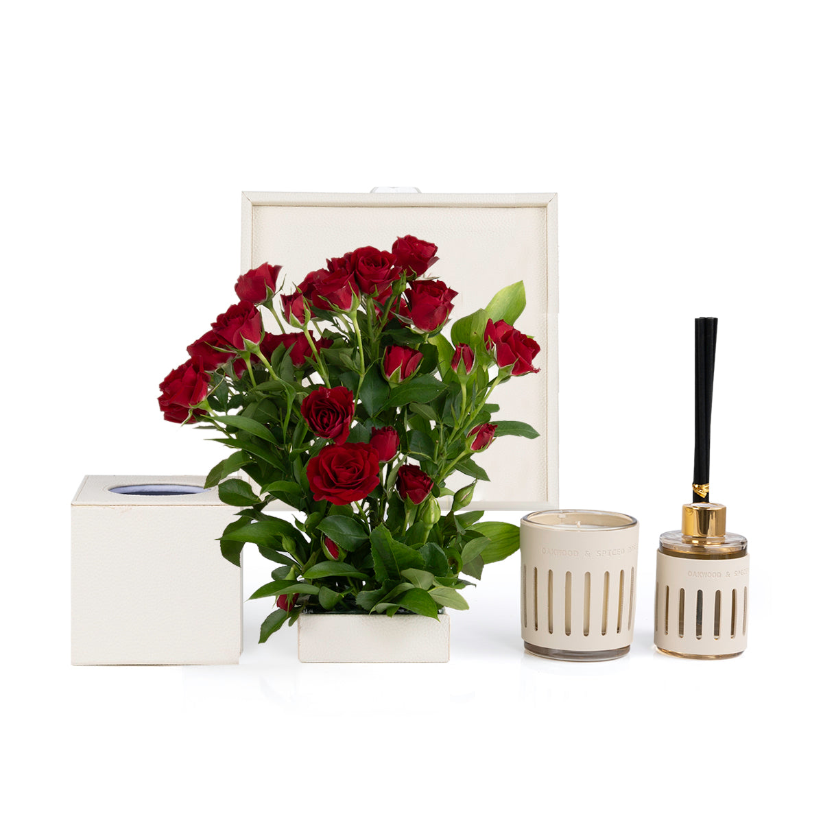 Beige Leather tray with matching tissue box, red roses, candle, and diffuser
