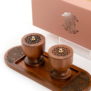 Brown wooden incense burner and bowl on a matching tray