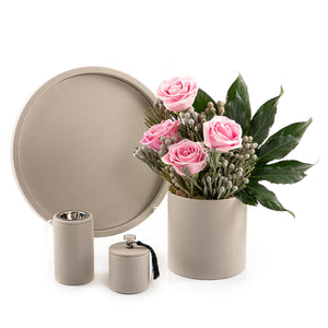 A grey leather set includes circle tray, incense burner, jar, and flower vase