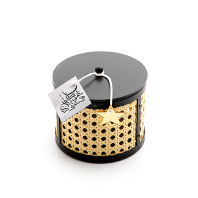 Decorated black wooden box with a customized name label 