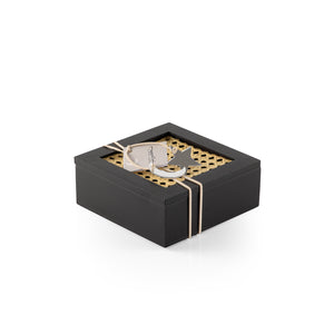 Decorated black square wooden box with a customized name label 