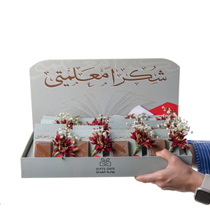 box of chocolate decorated with flower