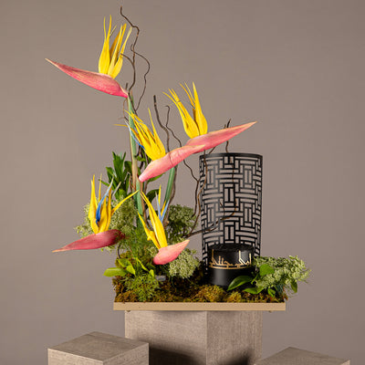 A flower tray with a black incense burner featuring a customized name 