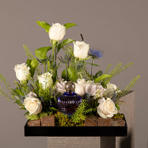 A chocolate tray with perfume from the Signature Collection, decorated with white roses