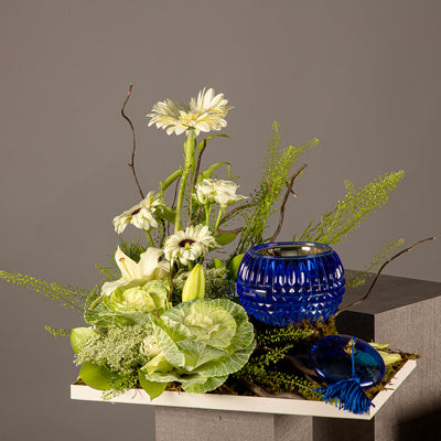 A tray decorated with various white flowers and an incense burner from the Signature Collection