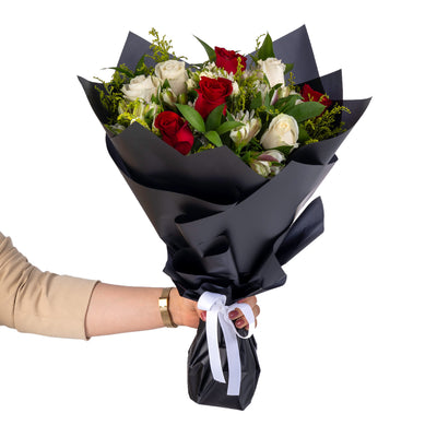 Elegant hand-tied bouquet featuring fresh deferent types of flowers -white ad red roses