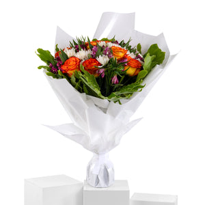 Elegant hand-tied bouquet featuring fresh deferent types of flowers