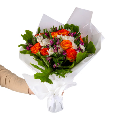 Elegant hand-tied bouquet featuring fresh deferent types of flowers