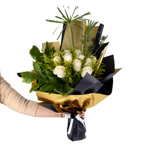 Elegant hand-tied bouquet featuring fresh deferent types of flowers