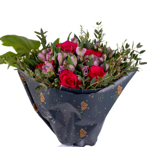 Elegant hand-tied bouquet featuring fresh deferent types of flowers