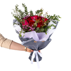 Elegant hand-tied bouquet featuring fresh deferent types of flowers