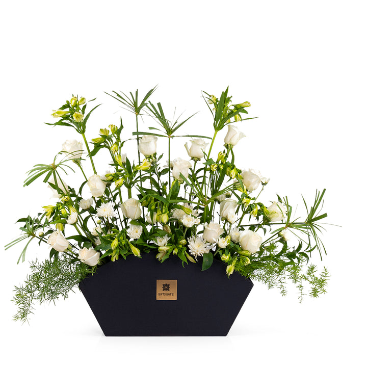 Elegant flower vase featuring fresh deferent types of white flowers