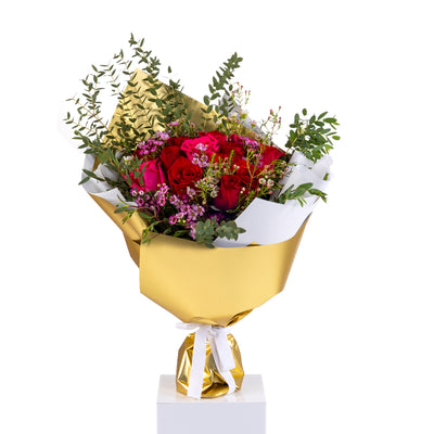 Elegant hand-tied bouquet featuring fresh pink roses