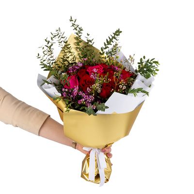 Elegant hand-tied bouquet featuring fresh pink roses