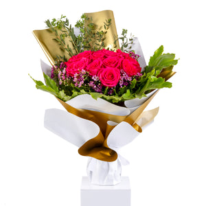 Elegant hand-tied bouquet featuring fresh pink roses