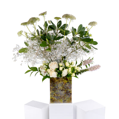 Elegant flower vase featuring fresh deferent types of white flowers
