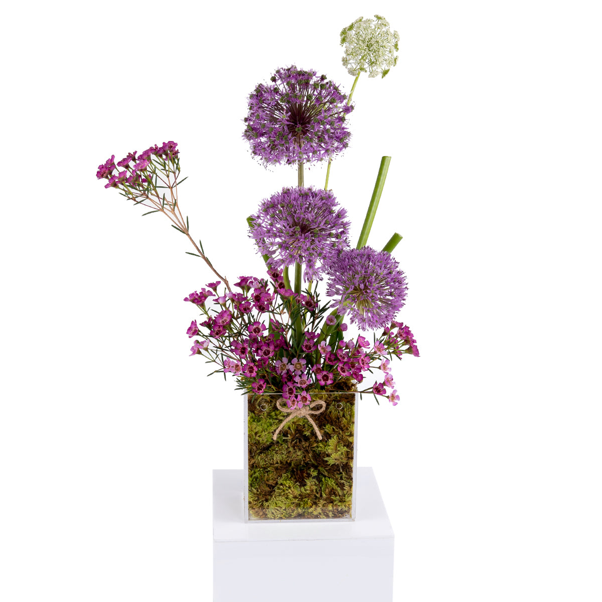 Elegant flower vase featuring fresh deferent types of purple flowers
