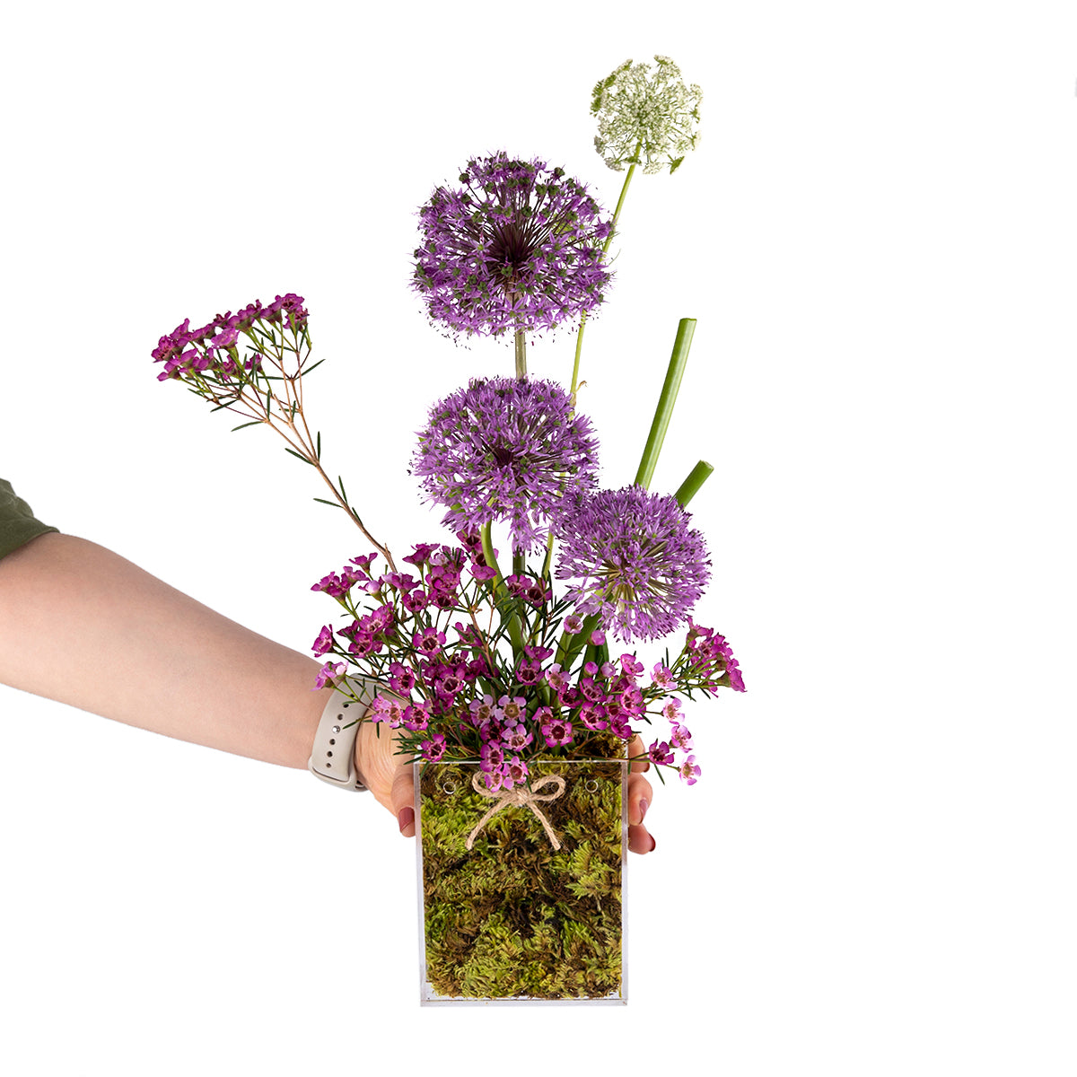 Elegant flower vase featuring fresh deferent types of purple flowers