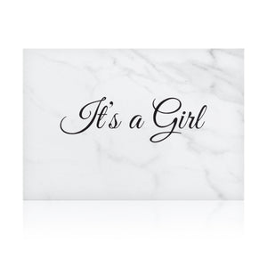 white marble new baby girl greeting card with the words 'It's a girl' written on it