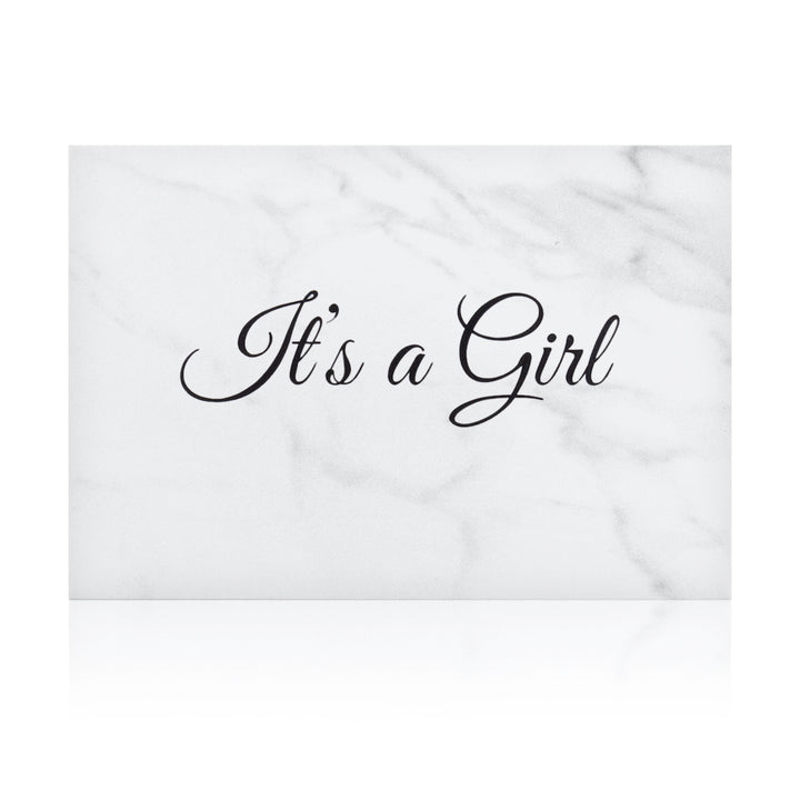 white marble new baby girl greeting card with the words 'It's a girl' written on it