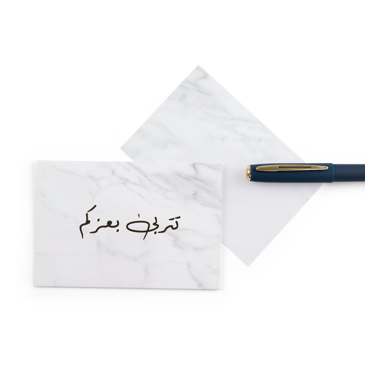white marble new baby girl greeting card with the words 'تتربى بعزكم' written on it