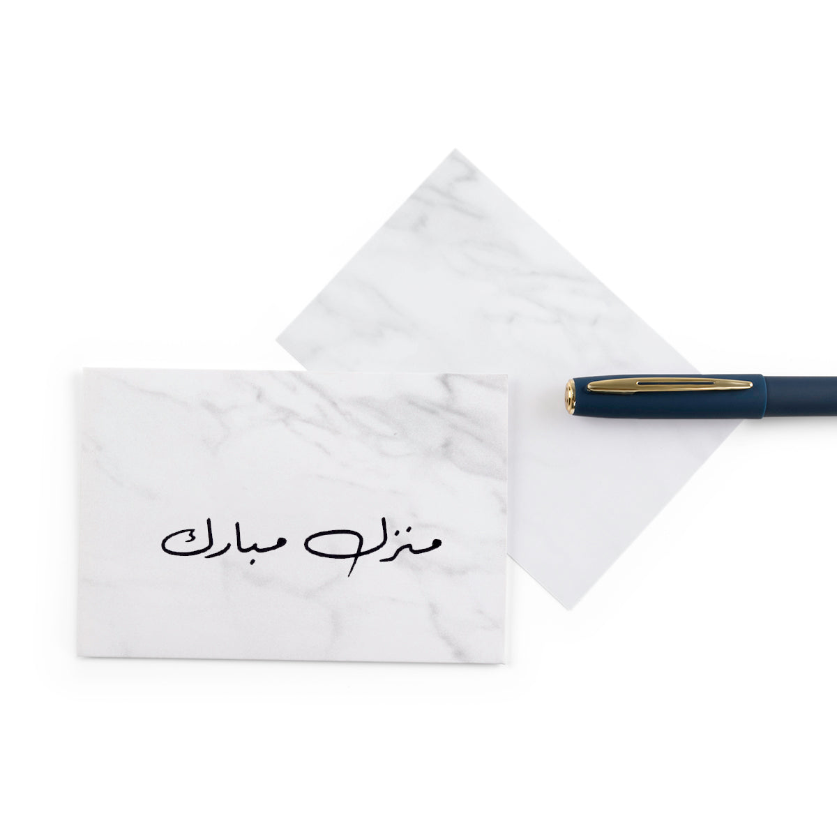 white marble greeting card for new house with the words 'منزل مبارك' written on it
