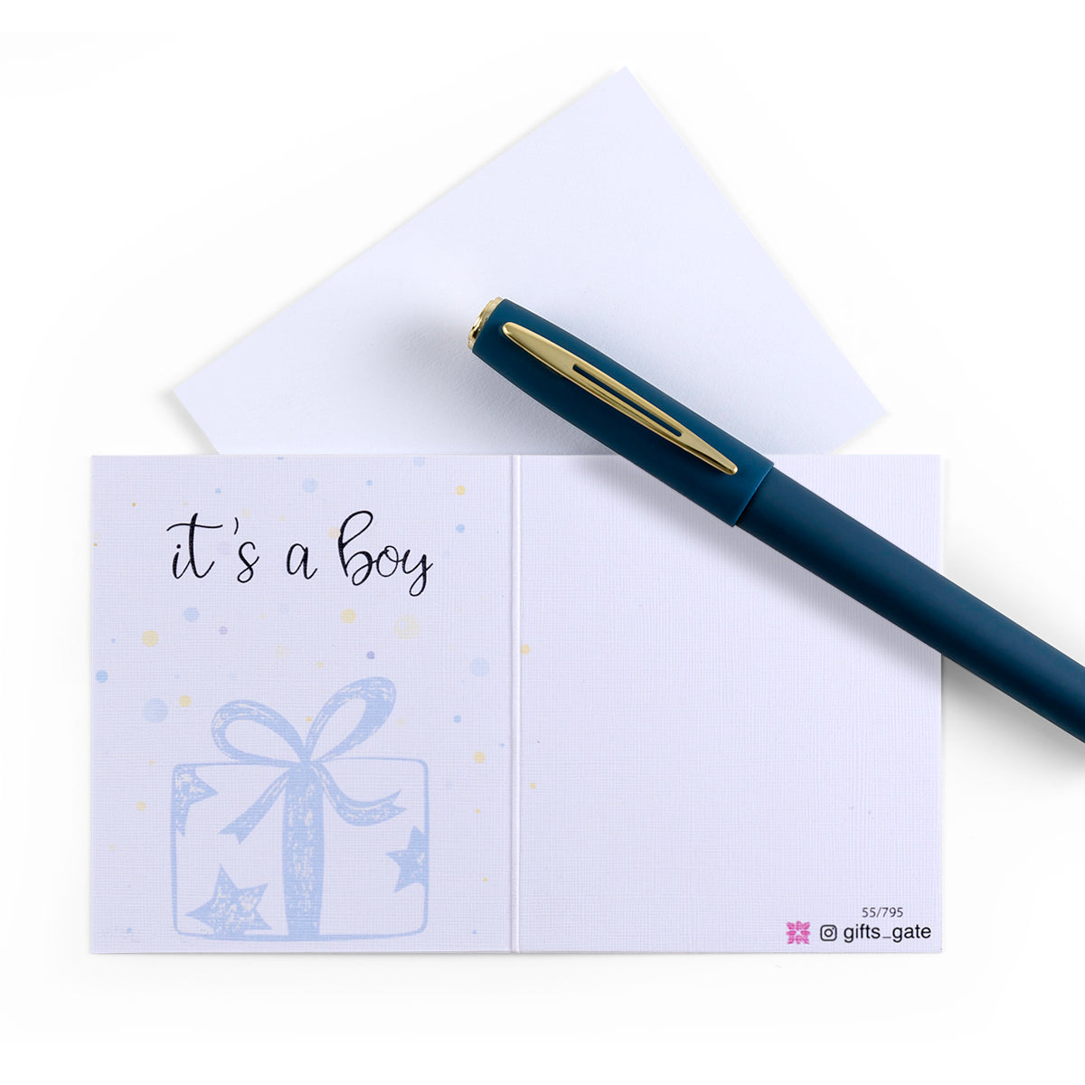 White and blue new baby boy greeting card with the words 'It's a boy' written on it