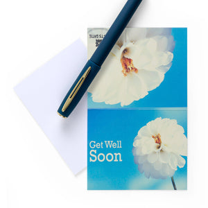 blue greeting card with the word ' get well soon ' written on it