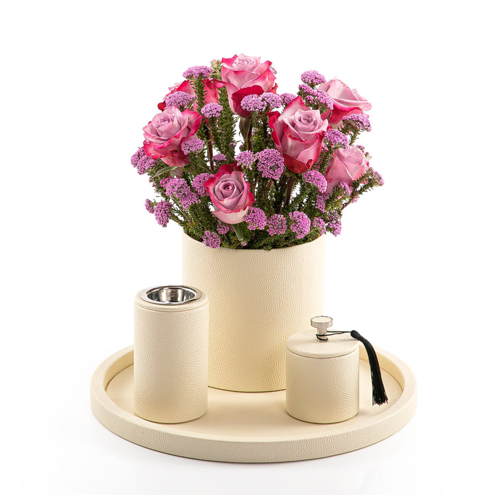 A white leather set includes circle tray, incense burner, jar, and flower vase