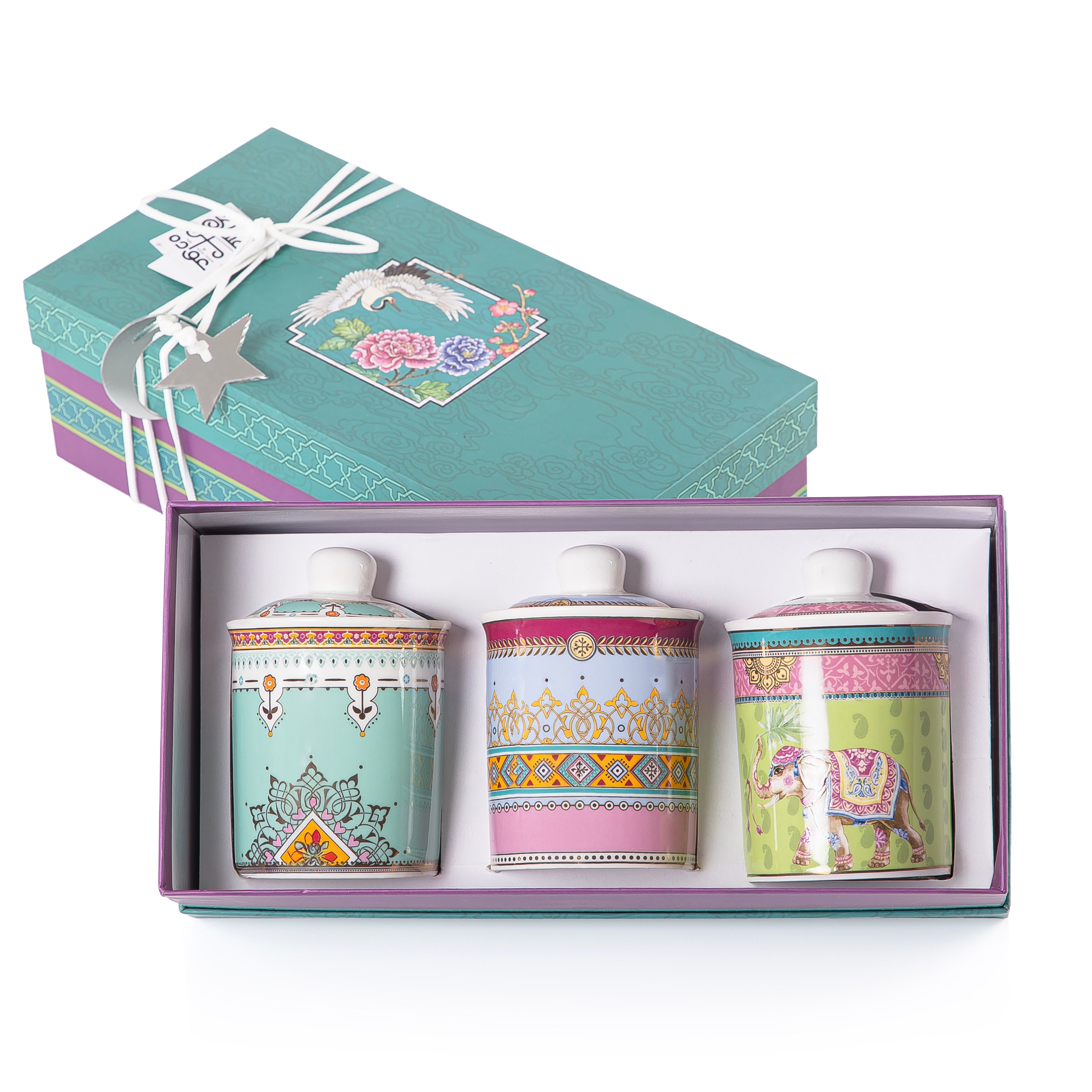 A set of three glasses decorated jars inside a gift box