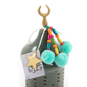 Decorated green metal box with a customized name label 