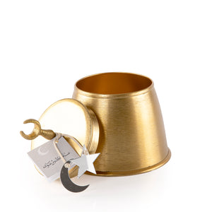 Decorated gold metal box with a customized name label 