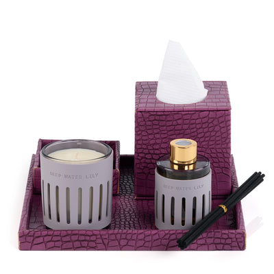 Purple leather tray with matching tissue box, plate, candle, and diffuser